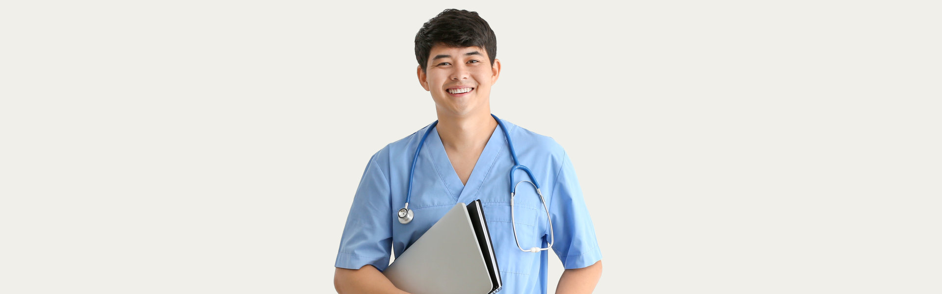 male nurse holding laptop