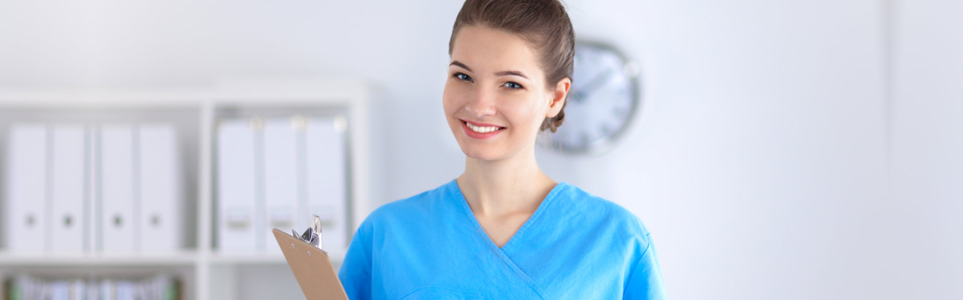 medical staff holding a clipboard