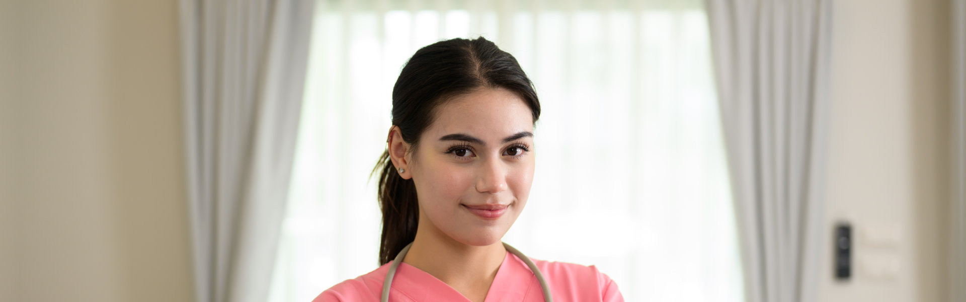 female nurse wearing pink uniform